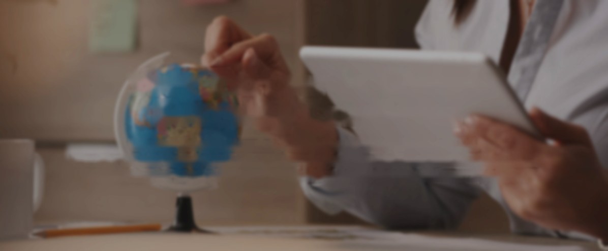 Sourcing specialist with a globe and tablet